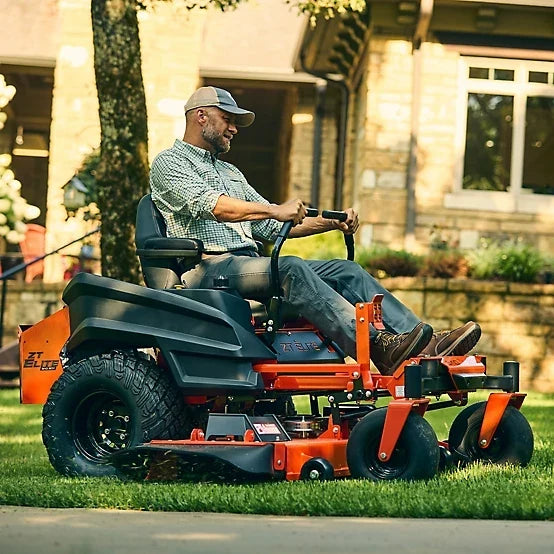 Pillowle Bad Boy ZT Elite 60-inch 26 HP gas zero-turn mower with cutting deck and control handles in a yard setting.