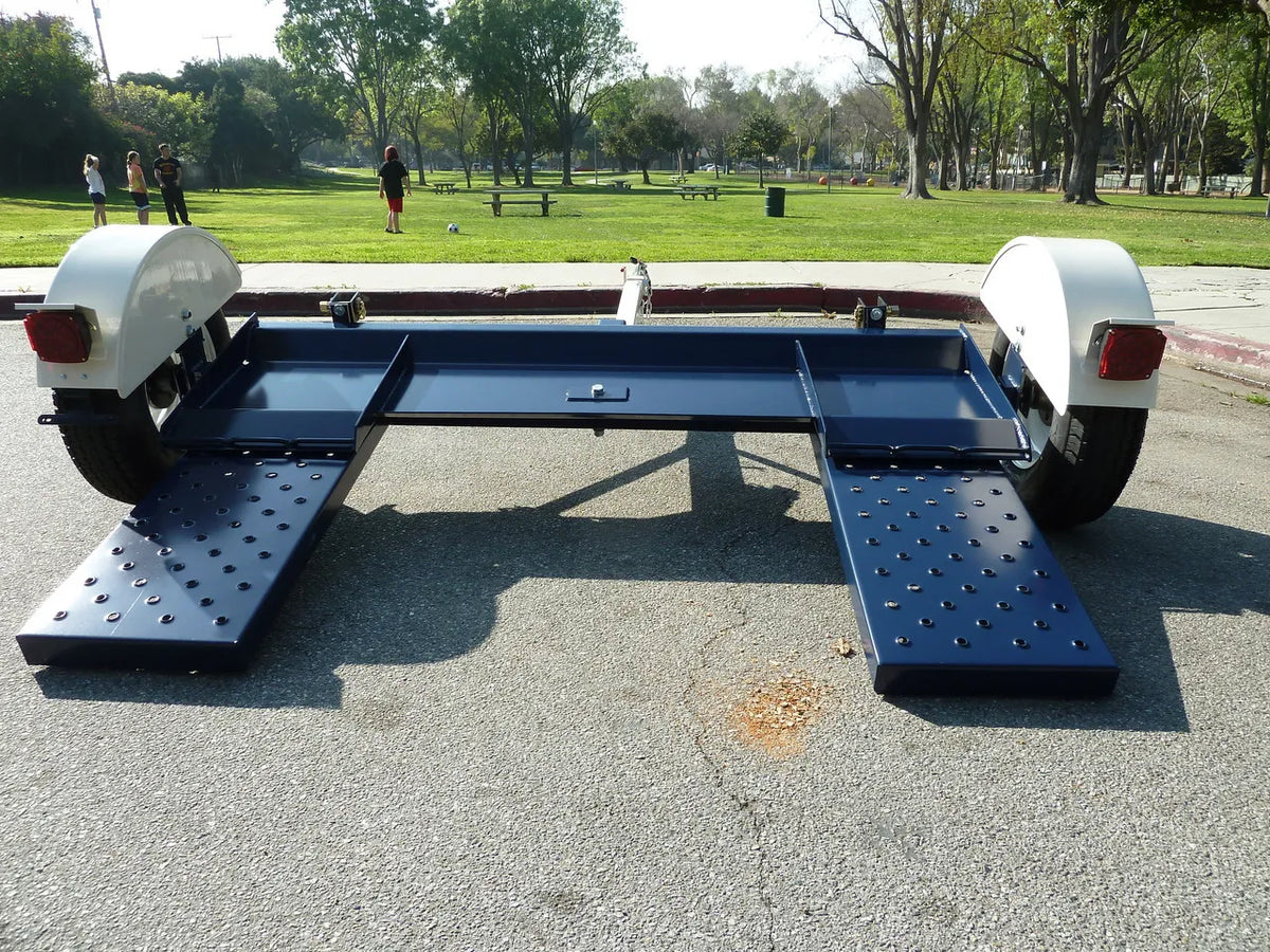 Heavy-duty Pillowle Tow Max vehicle tow dolly with 4,900 lb capacity, featuring sturdy construction and wheel straps.