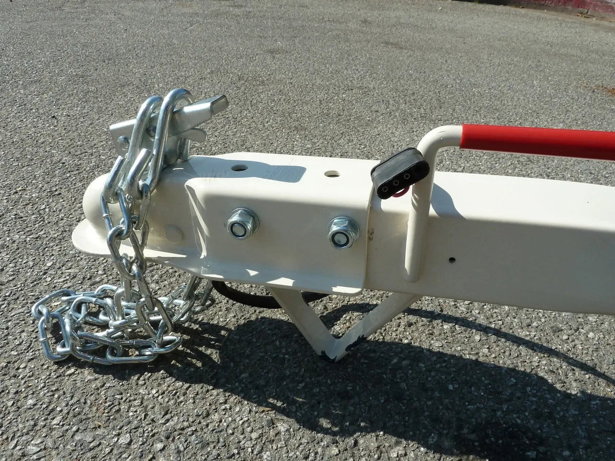 Heavy-duty Pillowle Tow Max vehicle tow dolly with 4,900 lb capacity, featuring sturdy tires and durable construction.